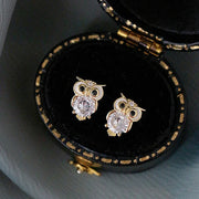 Gold owl stud earrings with sparkling crystals, perfect for jewelry websites, jewelry storage, vintage jewelry, and gifting for mom or jewelry lovers.