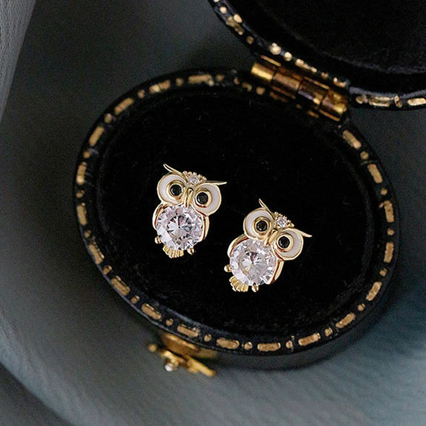 Gold owl stud earrings with sparkling crystals, perfect for jewelry websites, jewelry storage, vintage jewelry, and gifting for mom or jewelry lovers.