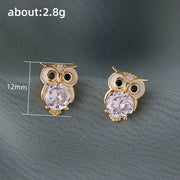 Gold owl stud earrings with sparkling crystals, perfect for jewelry websites, jewelry storage, vintage jewelry, and gifting for mom or jewelry lovers.