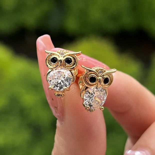 Gold owl stud earrings with sparkling crystals, perfect for jewelry websites, jewelry storage, vintage jewelry, and gifting for mom or jewelry lovers.