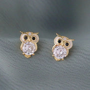 Gold owl stud earrings with sparkling crystals, perfect for jewelry websites, jewelry storage, vintage jewelry, and gifting for mom or jewelry lovers.