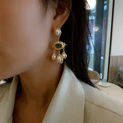 Unique eye and pearl drop earrings, ideal for jewelry storage, jewelry websites, vintage jewelry collections, and bold statement fashion for jewelry lovers.