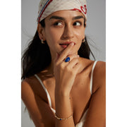 Gold ring with a bold blue gemstone, perfect for gem jewelry lovers, jewelry websites, and vintage jewelry enthusiasts. Ideal for jewelry storage, cleaning, and repair.