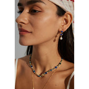 Elegant blue gemstone and pearl drop earrings - perfect for earrings piercing, earrings rings, and vintage jewelry lovers. Great for jewelry websites and jewelry storage ideas.
