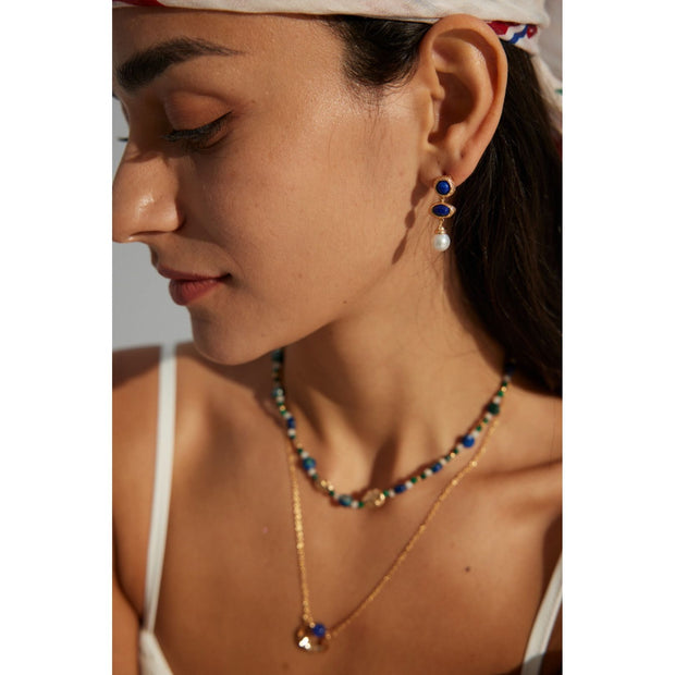 Elegant blue gemstone and pearl drop earrings - perfect for earrings piercing, earrings rings, and vintage jewelry lovers. Great for jewelry websites and jewelry storage ideas.