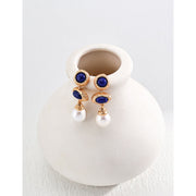 Elegant blue gemstone and pearl drop earrings - perfect for earrings piercing, earrings rings, and vintage jewelry lovers. Great for jewelry websites and jewelry storage ideas.