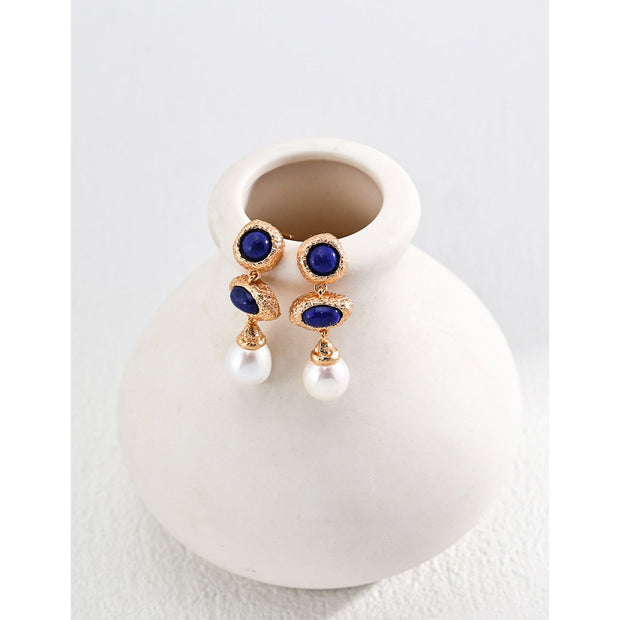 Elegant blue gemstone and pearl drop earrings - perfect for earrings piercing, earrings rings, and vintage jewelry lovers. Great for jewelry websites and jewelry storage ideas.