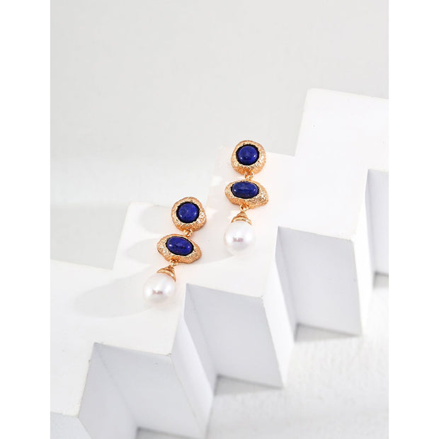 Elegant blue gemstone and pearl drop earrings - perfect for earrings piercing, earrings rings, and vintage jewelry lovers. Great for jewelry websites and jewelry storage ideas.