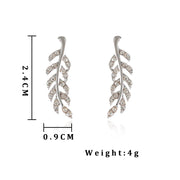 Crystal leaf earrings in silver and gold, perfect for jewelry websites, jewelry storage, vintage jewelry, gifting for mom, and nature-inspired fashion.