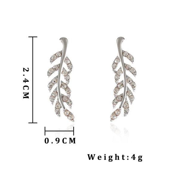 Crystal leaf earrings in silver and gold, perfect for jewelry websites, jewelry storage, vintage jewelry, gifting for mom, and nature-inspired fashion.