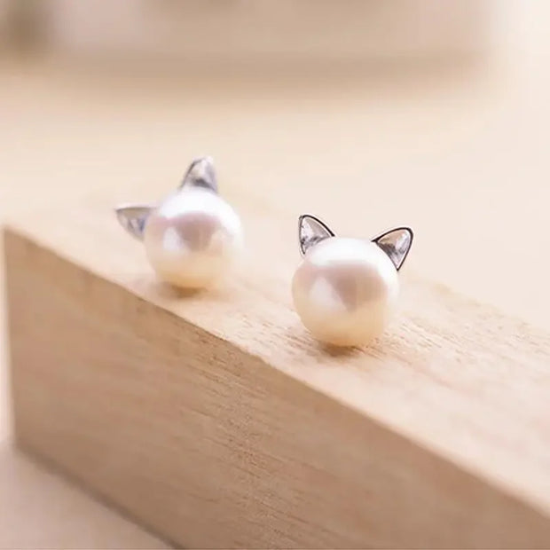 Adorable pearl stud earrings with silver cat ear accents, ideal for jewelry storage, vintage jewelry collections, or display on jewelry websites. Perfect for earrings piercing enthusiasts, jewelry cleaning tips, jewelry for mom gifts, and gem jewelry lovers. Great for permanent jewelry collections or pairing with body jewelry and earrings rings styles.