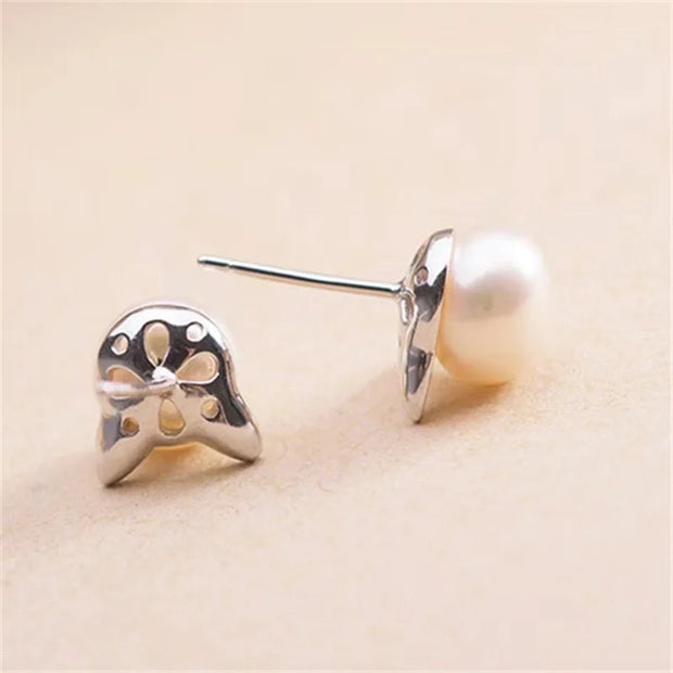 Adorable pearl stud earrings with silver cat ear accents, ideal for jewelry storage, vintage jewelry collections, or display on jewelry websites. Perfect for earrings piercing enthusiasts, jewelry cleaning tips, jewelry for mom gifts, and gem jewelry lovers. Great for permanent jewelry collections or pairing with body jewelry and earrings rings styles.