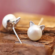 Adorable pearl stud earrings with silver cat ear accents, ideal for jewelry storage, vintage jewelry collections, or display on jewelry websites. Perfect for earrings piercing enthusiasts, jewelry cleaning tips, jewelry for mom gifts, and gem jewelry lovers. Great for permanent jewelry collections or pairing with body jewelry and earrings rings styles.