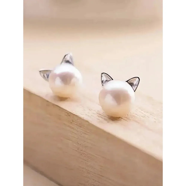Adorable pearl stud earrings with silver cat ear accents, ideal for jewelry storage, vintage jewelry collections, or display on jewelry websites. Perfect for earrings piercing enthusiasts, jewelry cleaning tips, jewelry for mom gifts, and gem jewelry lovers. Great for permanent jewelry collections or pairing with body jewelry and earrings rings styles.