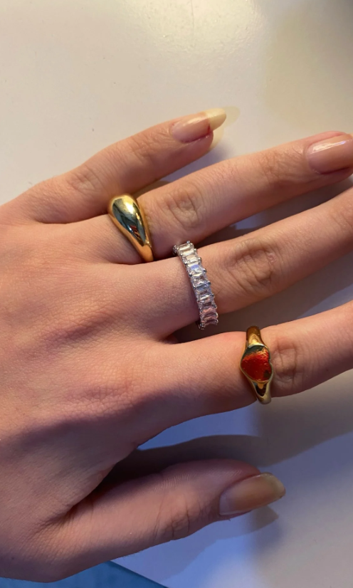 Elegant baguette diamond rings with gold and silver bands, ideal for jewelry designers, jewelry websites, and storage in a luxurious jewelry case.