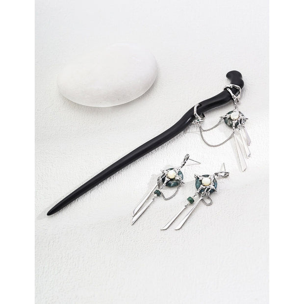 Elegant black hair stick with silver charms for mature women hairstyles, ideal for jewelry storage and jewelry cleaning. Perfect for jewelry designers, jewelry websites, and vintage jewelry lovers. Great for earrings piercing and body jewelry plus, as well as for those interested in permanent jewelry and jewelry repair close to me. A stylish addition for jewelry with turquoise, gem jewelry, and jewelry brands enthusiasts.