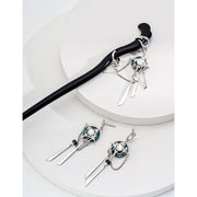Elegant black hair stick with silver charms for mature women hairstyles, ideal for jewelry storage and jewelry cleaning. Perfect for jewelry designers, jewelry websites, and vintage jewelry lovers. Great for earrings piercing and body jewelry plus, as well as for those interested in permanent jewelry and jewelry repair close to me. A stylish addition for jewelry with turquoise, gem jewelry, and jewelry brands enthusiasts.