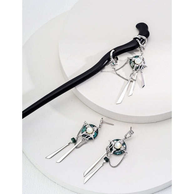 Elegant black hair stick with silver charms for mature women hairstyles, ideal for jewelry storage and jewelry cleaning. Perfect for jewelry designers, jewelry websites, and vintage jewelry lovers. Great for earrings piercing and body jewelry plus, as well as for those interested in permanent jewelry and jewelry repair close to me. A stylish addition for jewelry with turquoise, gem jewelry, and jewelry brands enthusiasts.