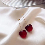 Cherry-inspired drop earrings with red stones and gold accents, perfect for jewelry websites, jewelry storage, vintage jewelry, and gifting for mom or jewelry lovers.