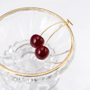 Cherry-inspired drop earrings with red stones and gold accents, perfect for jewelry websites, jewelry storage, vintage jewelry, and gifting for mom or jewelry lovers.