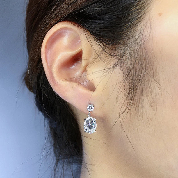 Elegant crystal drop earrings with sparkling oval-cut gems, perfect for mature women, modern earrings piercing, and vintage jewelry enthusiasts.