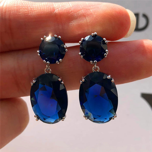 Elegant crystal drop earrings with sparkling oval-cut gems, perfect for mature women, modern earrings piercing, and vintage jewelry enthusiasts.
