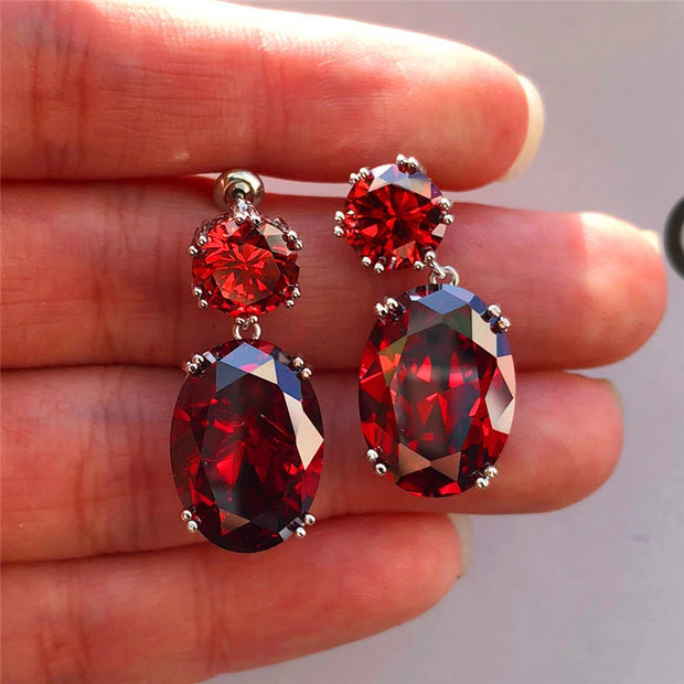 Elegant crystal drop earrings with sparkling oval-cut gems, perfect for mature women, modern earrings piercing, and vintage jewelry enthusiasts.