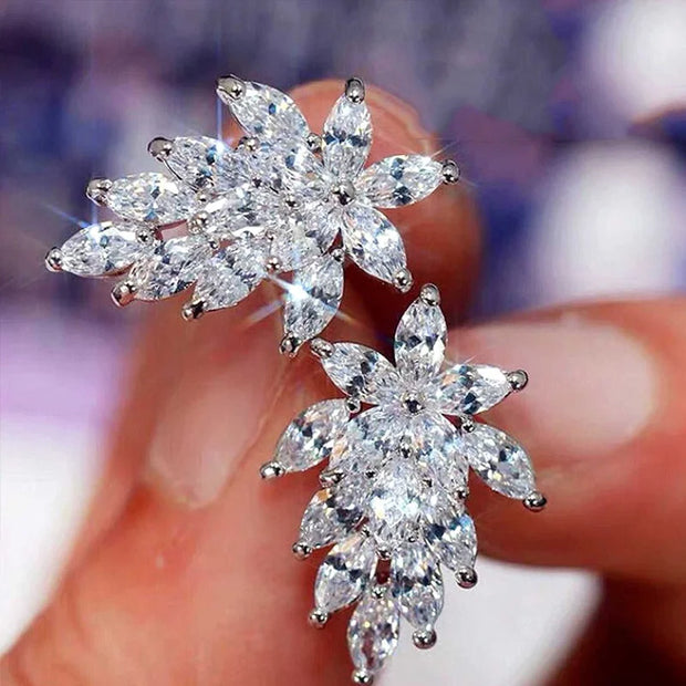 Crystal earrings in a velvet jewelry case, showcasing stunning craftsmanship by jewelry designers, perfect for elegant jewelry storage and earrings piercing styles.