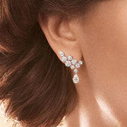 Crystal earrings in a velvet jewelry case, showcasing stunning craftsmanship by jewelry designers, perfect for elegant jewelry storage and earrings piercing styles.