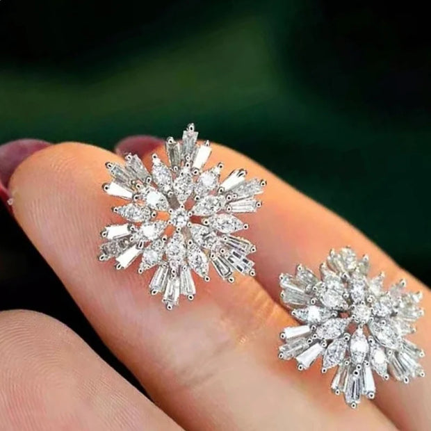 Crystal earrings in a velvet jewelry case, showcasing stunning craftsmanship by jewelry designers, perfect for elegant jewelry storage and earrings piercing styles.