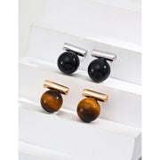 Elegant cufflinks with black and tiger eye stones in silver and gold accents, ideal for jewelry storage, jewelry websites, gem jewelry collections, and formal occasions.