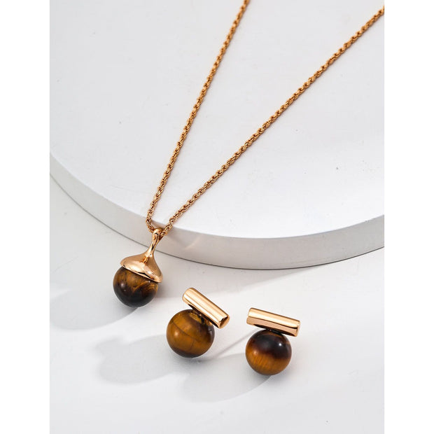 Elegant cufflinks with black and tiger eye stones in silver and gold accents, ideal for jewelry storage, jewelry websites, gem jewelry collections, and formal occasions.