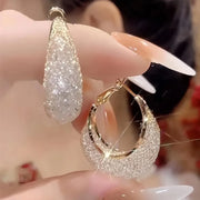 Diamond-encrusted gold hoop earrings for earrings piercing, jewelry storage, jewelry websites, and vintage jewelry lovers. Perfect for jewelry designers or jewelry for mom.