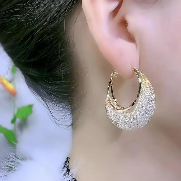 Diamond-encrusted gold hoop earrings for earrings piercing, jewelry storage, jewelry websites, and vintage jewelry lovers. Perfect for jewelry designers or jewelry for mom.