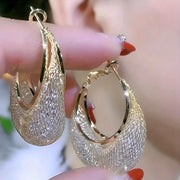 Diamond-encrusted gold hoop earrings for earrings piercing, jewelry storage, jewelry websites, and vintage jewelry lovers. Perfect for jewelry designers or jewelry for mom.