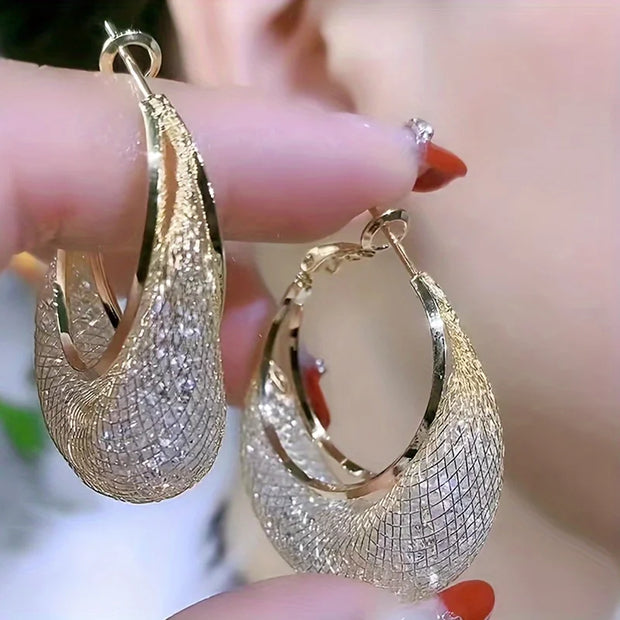 Diamond-encrusted gold hoop earrings for earrings piercing, jewelry storage, jewelry websites, and vintage jewelry lovers. Perfect for jewelry designers or jewelry for mom.