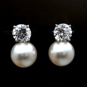 Elegant diamond and pearl stud earrings for jewelry lovers, ideal for earrings piercing and body jewelry storage. Perfect for vintage jewelry collections or jewelry websites.