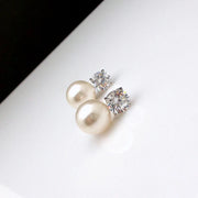 Elegant diamond and pearl stud earrings for jewelry lovers, ideal for earrings piercing and body jewelry storage. Perfect for vintage jewelry collections or jewelry websites.