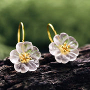 Floral crystal earrings with gold accents, perfect for jewelry websites, jewelry storage, vintage jewelry, earrings piercing, and as a gift for mom or nature lovers.
