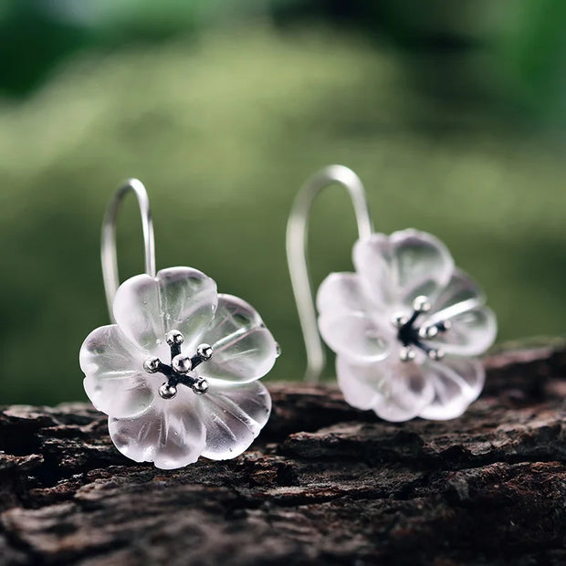 Floral crystal earrings with gold accents, perfect for jewelry websites, jewelry storage, vintage jewelry, earrings piercing, and as a gift for mom or nature lovers.