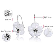 Floral crystal earrings with gold accents, perfect for jewelry websites, jewelry storage, vintage jewelry, earrings piercing, and as a gift for mom or nature lovers.