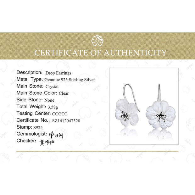 Floral crystal earrings with gold accents, perfect for jewelry websites, jewelry storage, vintage jewelry, earrings piercing, and as a gift for mom or nature lovers.