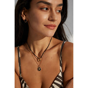 Gold-plated pendant necklace with black beads, ideal for jewelry storage, vintage jewelry collections, jewelry websites, and as a timeless accessory for any occasion.