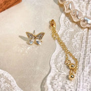 Butterfly gold earrings with dangling chains, perfect for earrings piercing, jewelry storage, jewelry websites, vintage jewelry, and jewelry for mom.