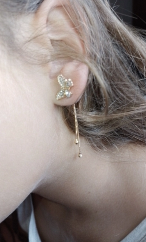 Butterfly gold earrings with dangling chains, perfect for earrings piercing, jewelry storage, jewelry websites, vintage jewelry, and jewelry for mom.