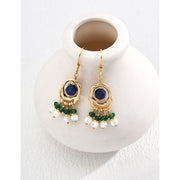 Gold earrings with blue gemstones, green beads, and pearl danglers, perfect for jewelry websites, jewelry storage, vintage jewelry, and jewelry for mom.