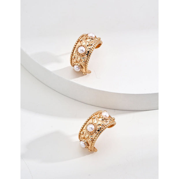 Vintage gold cuff earrings with pearls, ideal for earrings piercing, jewelry storage in a jewelry case, and perfect for mature women hairstyles; timeless jewelry for mom by top jewelry brands.