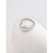 Gold and silver dome rings on a white surface, showcasing modern jewelry design for jewelry storage and websites. Perfect for vintage jewelry enthusiasts and jewelry designers looking to highlight timeless statement pieces. Suitable for mature women hairstyles, gem jewelry lovers, and fans of earrings rings combinations or turquoise jewelry.