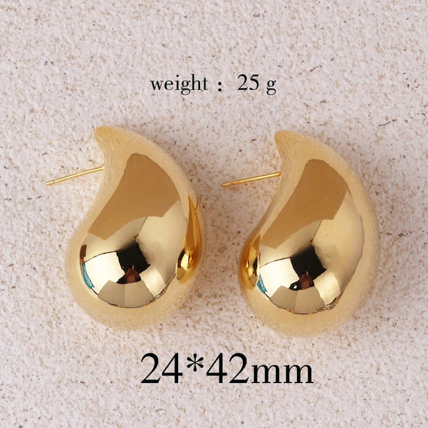 Gold teardrop earrings for earrings piercing, jewelry storage, vintage jewelry, jewelry websites, and jewelry for mom. Perfect for elegant and timeless looks