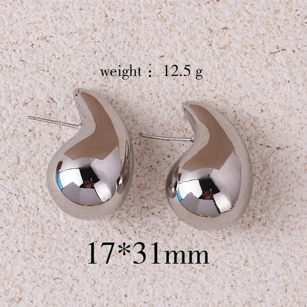 Gold teardrop earrings for earrings piercing, jewelry storage, vintage jewelry, jewelry websites, and jewelry for mom. Perfect for elegant and timeless looks